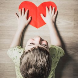 child holding a heart