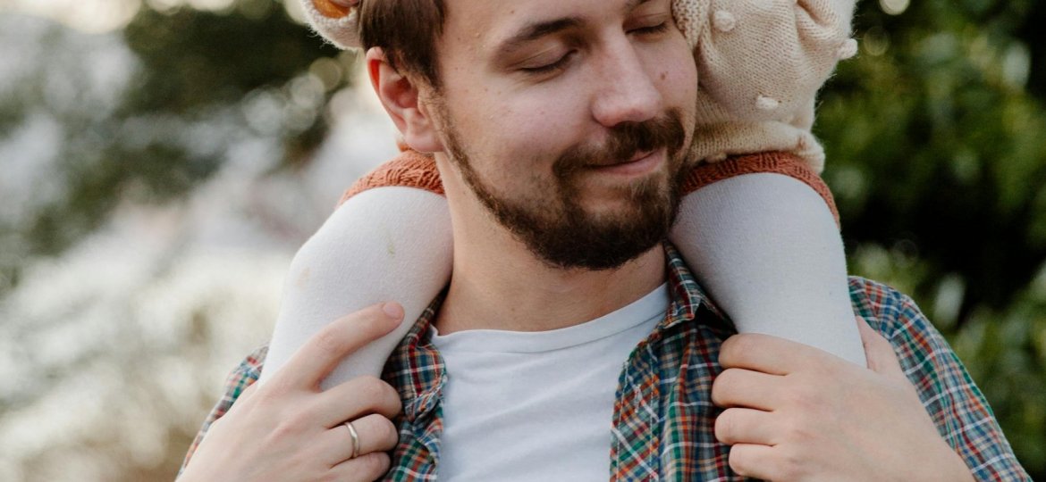 Father and daughter, daughter on fathers shoulders