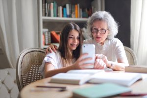 grandmother taking selfie with granddaughter 