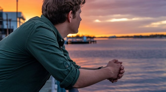 man looking at the sunset in the horizon