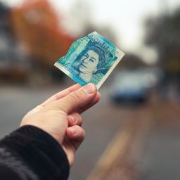 five pound note torn in half