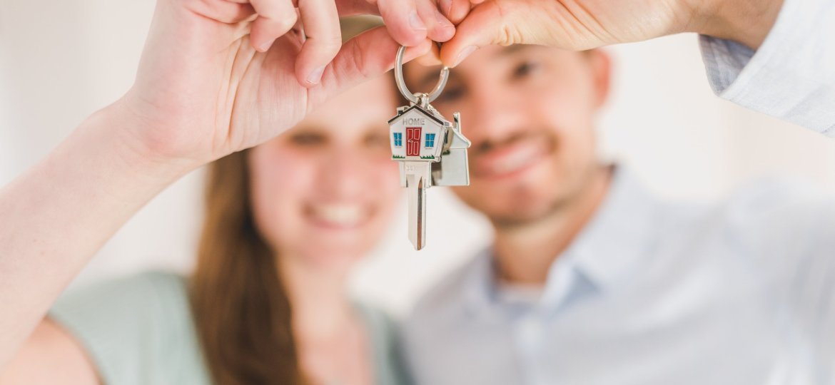 Couple holding house keys