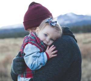 Father hugging little girl