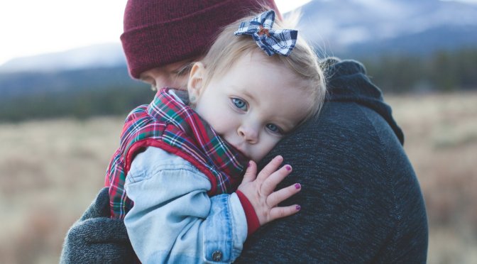 Father hugging little girl