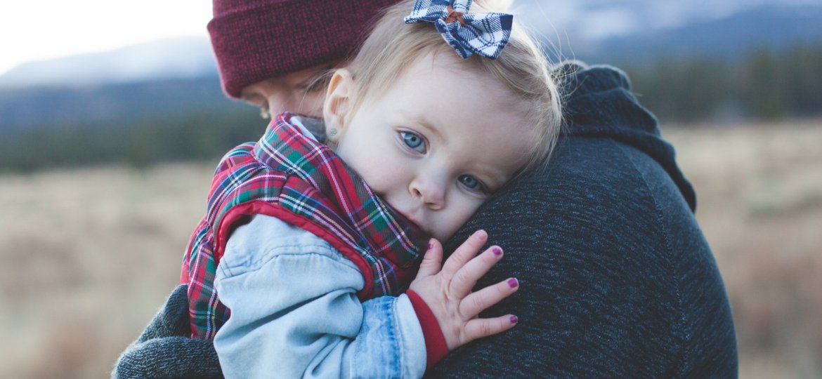 Father hugging little girl