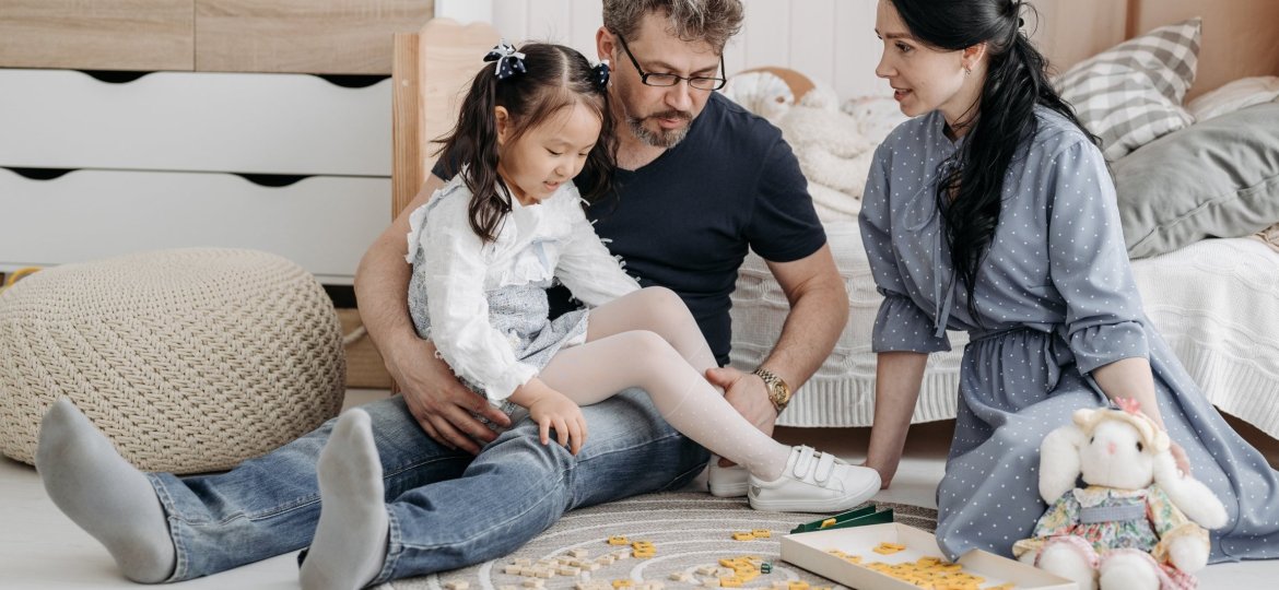 parents talking with small child