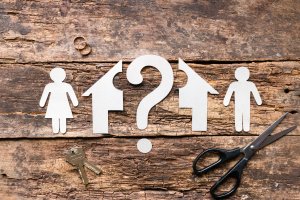 Splitting Marital Assets Paper cut out man and woman