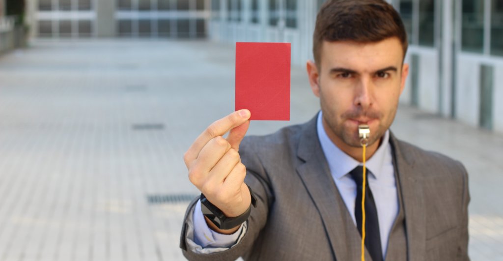 mediator with a whistle and a red card