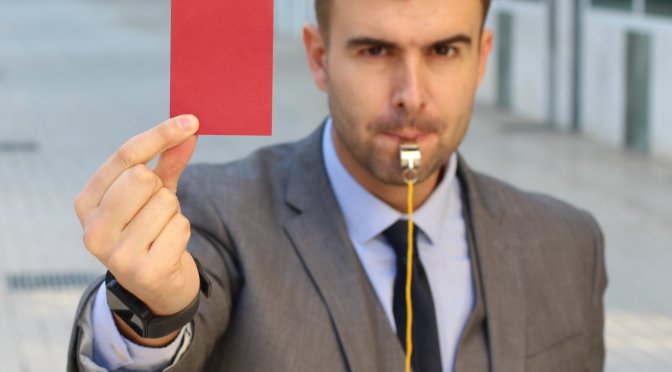 Businessman,With,Whistle,And,Red,Card