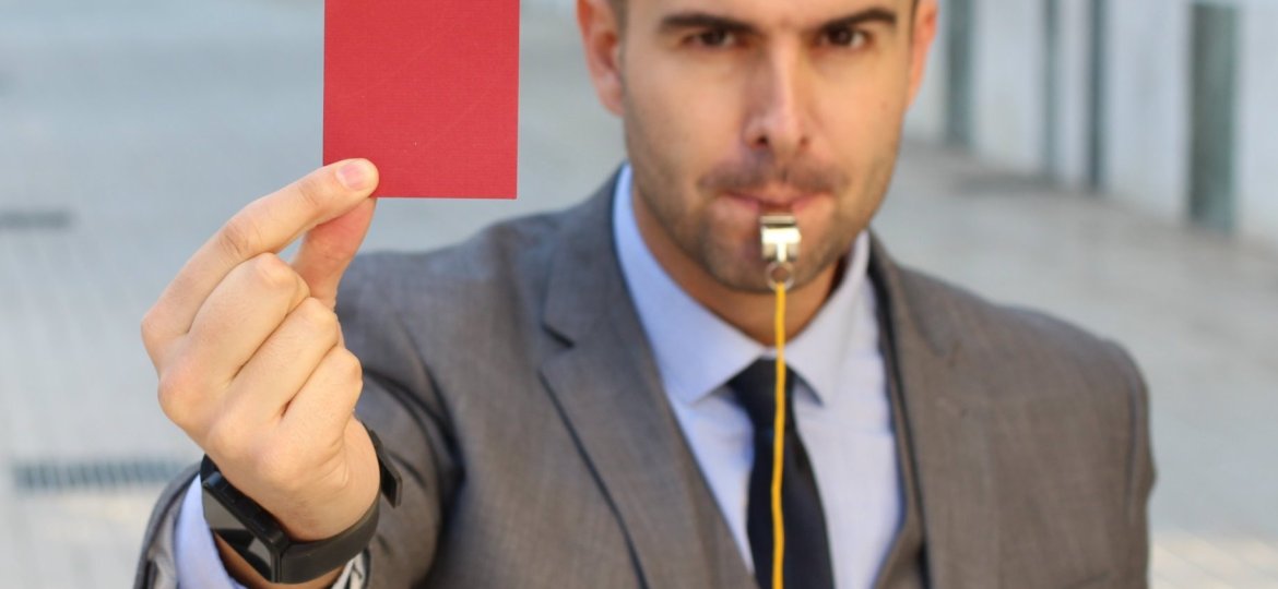 Businessman,With,Whistle,And,Red,Card