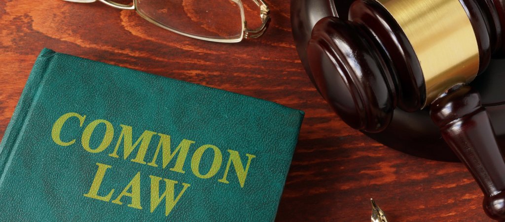 Book with title common law on a table.