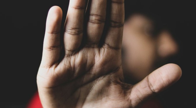 hand up in front of face - safeguarding concerns