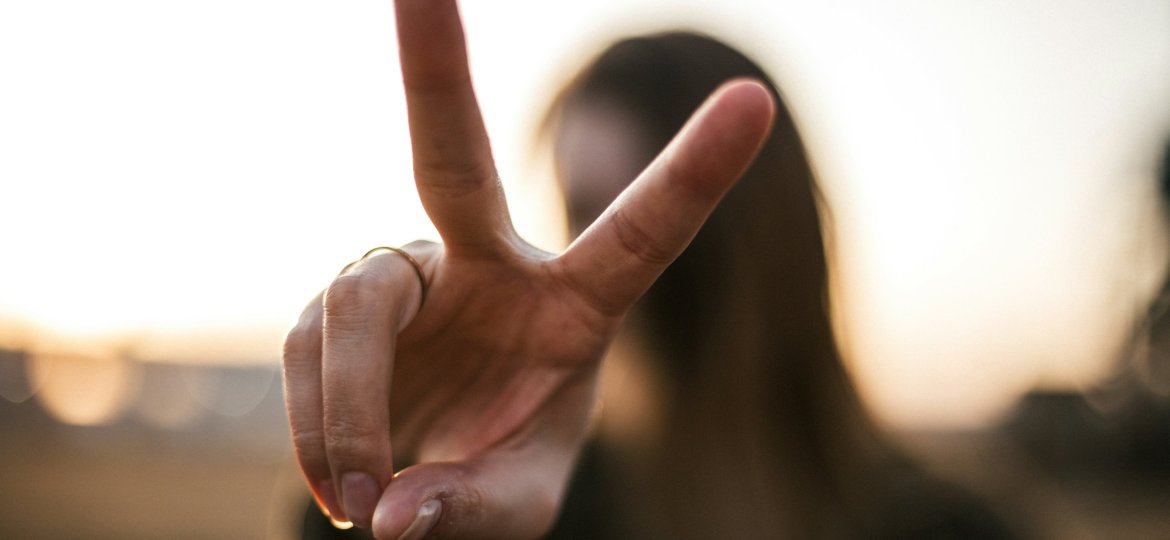 two fingers indicating peace