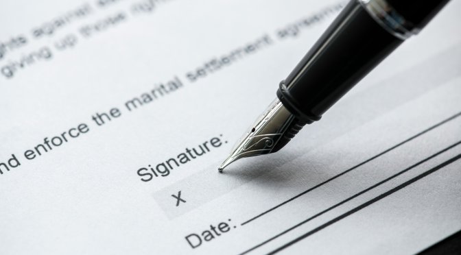 Signing a legal marital agreement